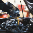 Oil being poured into car