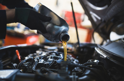 Oil being poured into car