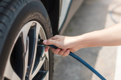 Person filling up their tire